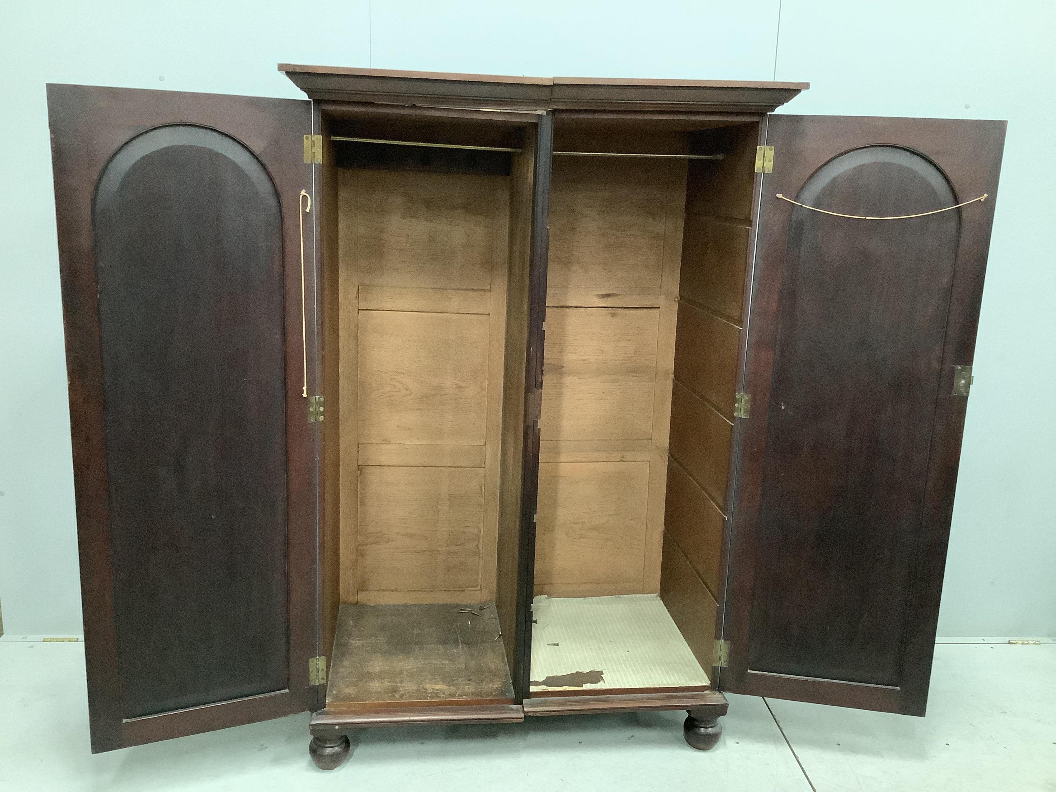 A Victorian mahogany two door hanging wardrobe, adapted, width 119cm, depth 67cm, height 175cm. Condition - poor